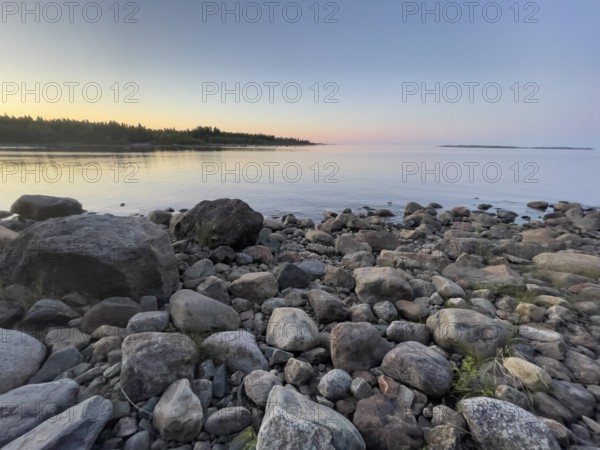 Midsummer on the Gulf of Bothnia at sunset with a stone shore, Ånäset, Västerbottens län, Sweden