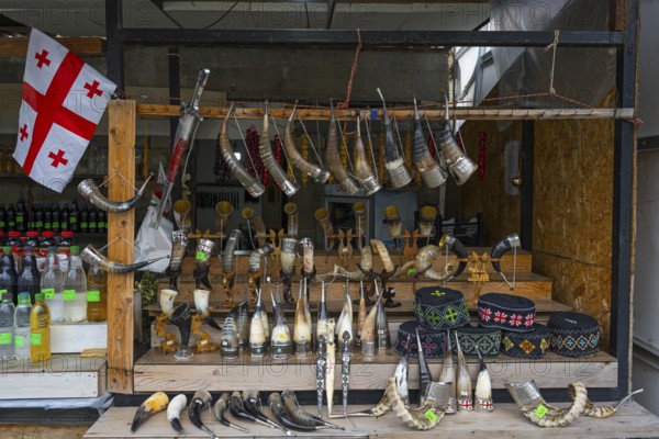 Market stall with Georgian souvenirs such as drinking horns and handmade items, Mtskheta, Mtskheta, Mtskheta-Mtianeti region, Georgia