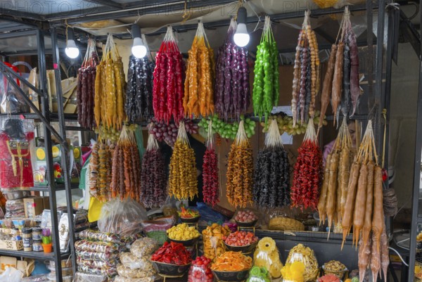Diverse market stand with colorful hung Georgian sweets and dried fruits, Churchkhela, Georgian confections, 'Georgian Snickers', Mtskheta, Mtskheta, Mtskheta, Mtskheta, Mtskheta-Mtianeti region, Georgia