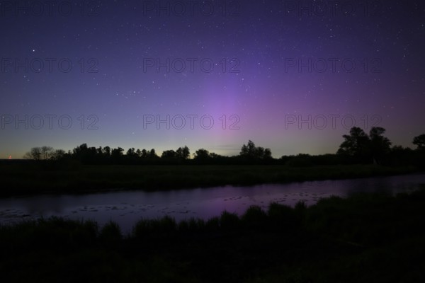 Aurora borealis aurora borealis on the Hunte dyke, Dümmerniederung nature park Park, Lower Saxony, Germany