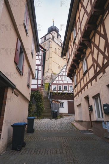Charming old town street with half-timbered houses and small shops, collegiate church, Herrenberg, Böblingen district, Germany