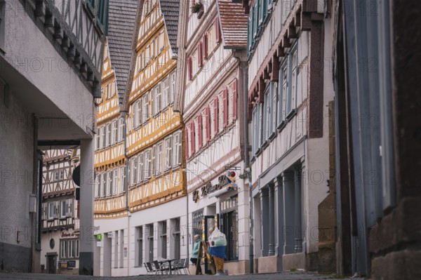 Narrow street with numerous half-timbered houses in the old town, Herrenberg, Böblingen district, Germany