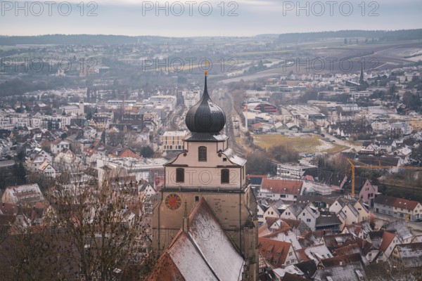 Overview of the town with a distinctive church tower and snowy surroundings, Herrenberg, Böblingen district, Germany