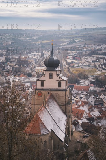 Panorama of the city with a church tower standing in the foreground and winter atmosphere, Herrenberg, Böblingen district, Germany