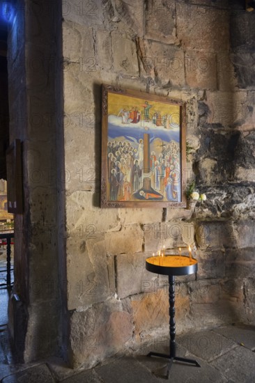 Religious icon on a stone wall with a burning candle in front of it, Javari Monastery, Dzhwari Church, Cross Monastery, UNESCO World Heritage Site, Mtskheta, Mtskheta, Mtskheta, Mtskheta-Mtianeti Region, Georgia