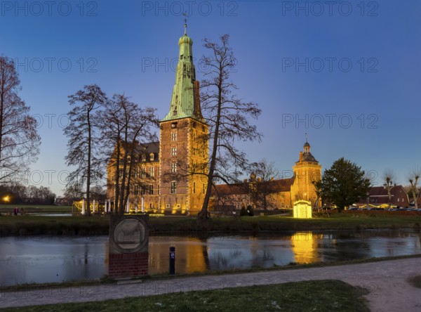 View in winter over partially frozen moat at castle converted into a Renaissance castle today Raesfeld moated castle from 14th to 17th century with main castle in front, part of Vorburg in the background, Freiheit Raesfeld, Hohe Mark nature park Park, Münsterland, North Rhine-Westphalia, Germany