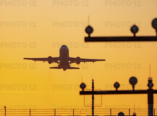 Runway lighting, approach aids, at Düsseldorf International Airport, sunset, aircraft taking off, Hauptbahn Süd, 05R/23L, North Rhine-Westphalia, Germany