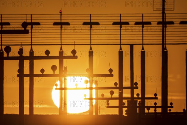 Runway lighting, approach aids, at Düsseldorf International Airport, sunset, Hauptbahn Süd, 05R/23L, North Rhine-Westphalia, Germany