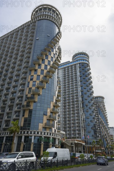 Modern skyscrapers with spiral balconies dominate the city skyline under cloudy sky, Orbi Sea Towers, Batumi, Black Sea, Ajara region, Adjara, Autonomous Republic, Georgia