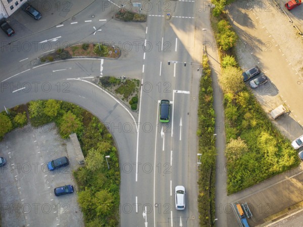Aerial view of a street scene with cars at an intersection and green spaces, Deer E-Mobility Shuttle Service, Calw, Germany