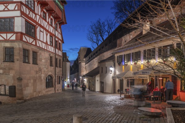 The old city wall with rampart, on the left the historic Dürerhaus, in evening lighting, Beim Tiergärtnertor, Nuremberg, Middle Franconia, Bavaria, Germany