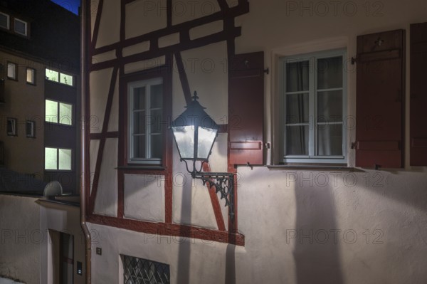 Old lantern on an old half-timbered house, Nuremberg, Middle Franconia, Bavaria, Germany