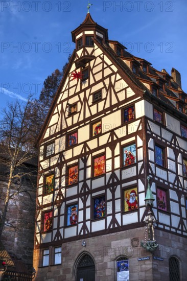 Historic Pilate House with Advent Calendar in the Evening Sun, Beim Tiergärtnertor, Nuremberg, Middle Franconia, Bavaria, Germany