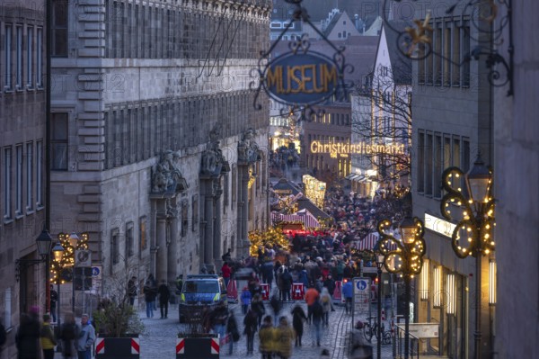 View of the secured entrance to the Nuremberg Christmas Market in the evening, on the left the historic Woff'sche Rathaus, Nuremberg, Middle Franconia, Bavaria, Germany