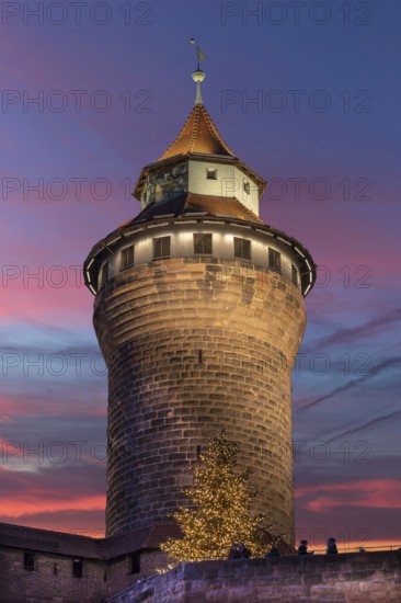 Illuminated Sinwell Tower, built in the 13th century, in the evening sky, Kaiserburg, Nuremberg, Middle Franconia, Bavaria, Germany