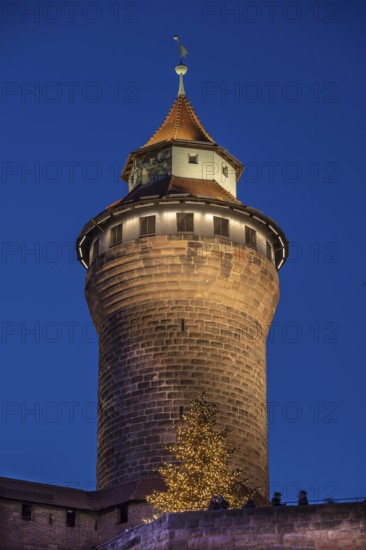Sinwell tower illuminated in the evening, built in the 13th century, Kaiserburg, Nuremberg, Middle Franconia, Bavaria, Germany