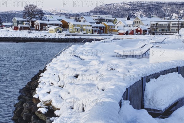 Wintery houses on snow-covered shore, Mo i Rana, Norway