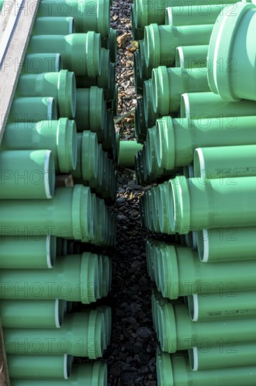 Symbolic picture construction site, sewage pipes for dirty and rainwater, for installation in the ground, plastic pipes, made of polypropylene, storage on a construction site