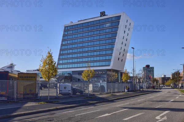 Schwedenkai ferry terminal, general development, commercial building, modern architecture, lanes, lantern, metal fence, trees, blue sky, cloudless, Kaistraße, Kiel, state capital, district-free city, Schleswig-Holstein, Germany