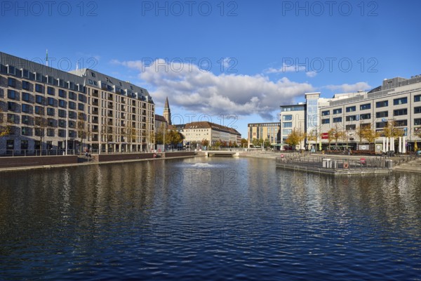 Boat harbor, triangular water area, general architecture, commercial buildings, modern buildings, abstract reflections on the water surface, seating steps, façade with windows, blue sky, cumulus clouds, street wall, Berliner Platz and Holstenbrücke, Kiel, state capital, district-free city, Schleswig-Holstein, Germany