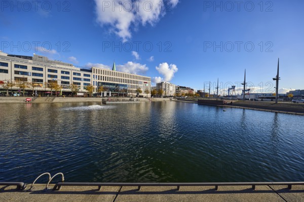 Boat harbor, triangular water area, general architecture, modern buildings, gym, John Reed Fitness, ventilation pump, abstract reflections on the water surface, seating steps, trees, blue sky, cumulus clouds, Wall and Kaistraße roads, Kiel, state capital, district-free city, Schleswig-Holstein, Germany