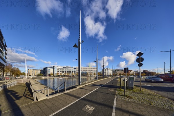 Boat harbor, triangular water area, lantern, general architecture, modern buildings, sidewalk, footpath and bike path, blue sky, cumulus clouds, Wall, Holstenbrücke and Kaistraße roads, Kiel, state capital, district-free city, Schleswig-Holstein, Germany