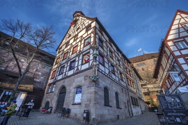 Historic Pilate House with the annual advent calendar in the evening light, Tiergärtnertor, Nuremberg, Middle Franconia, Bavaria, Germany