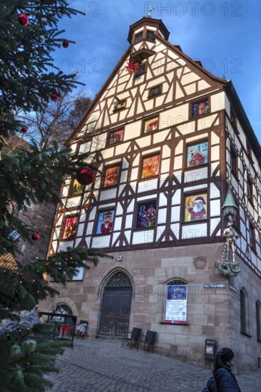 Historic Pilate House with the annual advent calendar in the evening light, Tiergärtnertor, Nuremberg, Middle Franconia, Bavaria, Germany