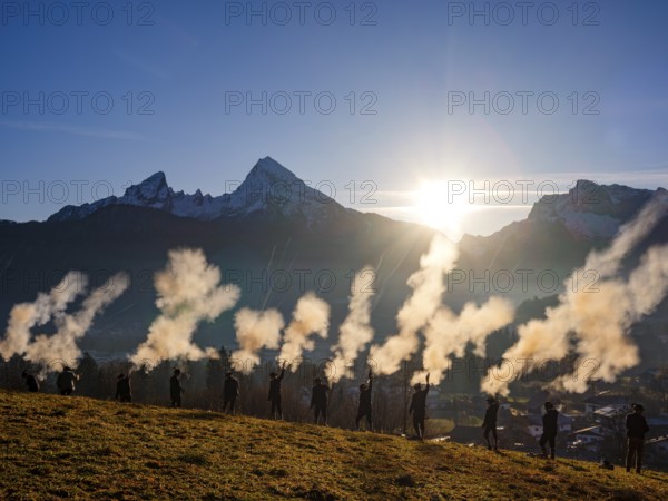 Berchtesgaden Christmas shooters, firecrackers shoot down their firecrackers in front of the Watzmann and Hochkalter, Bischofswiesen, Berchtesgadener Land, Upper Bavaria, Germany