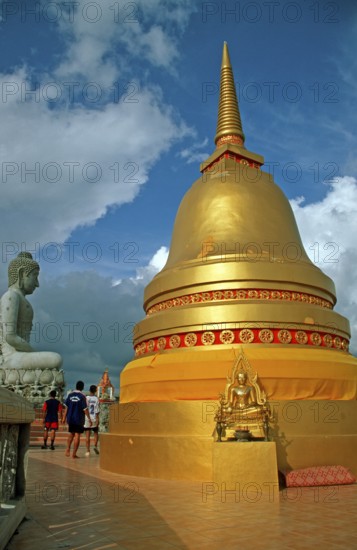 People, Buddha statue, chedi in Wat Tam Sua monastery, which is partly on the top of a mountain, Krabi, Thailand, December 2002, vintage, retro, old, historic