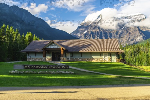 Mount robson provincial park welcome center building rising against majestic mountains and lush greenery, inviting exploration of british columbia's natural wonders