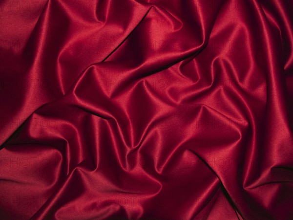 Elegant red satin with shiny shimmer and ornate wrinkles, clothing, background, velvety, solemn, gentle, festive, Christmas, texture, glamor, luxury, luxurious, warm color, decoration, symbol of sensuality, beauty, love, seduction, sexy, erotic, seduction, seductive, eros, sex, eroticism, love, Germany