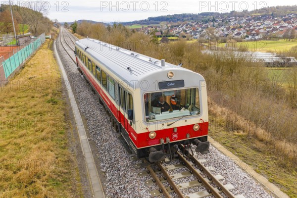 Train on the rails with a view of the city and countryside in the background, inscription 'Calw', historic event, first test run with a passenger train on the Hermann tracks, Hesse Railway since 1988, Calw district, Germany