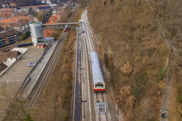 A station with a train that stops on the tracks while the autumn surroundings are visible, historic event, first test run with a passenger train on the Hermann tracks, Hesse Railway since 1988, Calw, Calw district, Germany