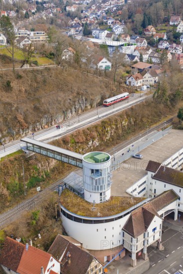 Architecture and a train on an elevated position with a view of houses and other buildings, historic event, first test run with a passenger train on the Hermann tracks, Hesse Railway since 1988, Calw, Calw district, Germany