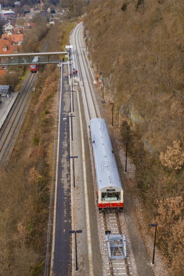Train on tracks along hills across a bridge in a winter environment, historic event, first test run with a passenger train on the Hermann tracks, Hesse Railway since 1988, Calw, Calw district, Germany