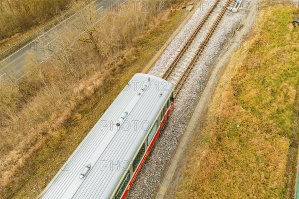 Top view of the top of a train on the rails, surrounded by nature, historic event, first test run with a passenger train on the Hermann tracks, Hesse Railway since 1988, Calw district, Germany
