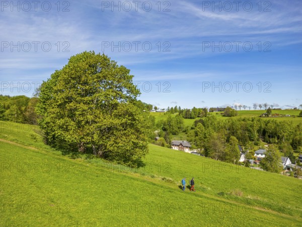 Aerial view, drone photo: Two hikers walk down the ridge trail through the Ore Mountains, health resort and toy village Seiffen, Ore Mountains, Saxony, Germany