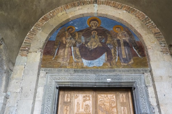 Fresco depicting Mary and Child Jesus and angels in a round arch above a decorated door, Svetitskhoveli Cathedral, Svetitskhoveli, UNESCO World Heritage Site, Mtskheta, Mtskheta, Mtskheta-Mtianeti region, Georgia