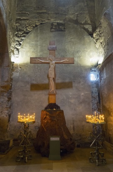 Interior of a church with a wooden cross and candlesticks on both sides, intimate religious atmosphere, Svetitskhoveli Cathedral, Svetitskhoveli, UNESCO World Heritage Site, Mtskheta, Mtskheta, Mtskheta-Mtianeti region, Georgia