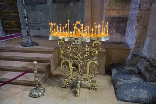 Bronze candle holder on an altar giving a church a solemn atmosphere, Svetitskhoveli Cathedral, Svetitskhoveli, UNESCO World Heritage Site, Mtskheta, Mtskheta, Mtskheta, Mtskheta-Mtianeti region, Georgia