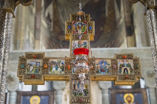 A richly decorated cross with icons and red accents in a church, Svetitskhoveli Cathedral, Svetitskhoveli, UNESCO World Heritage Site, Mtskheta, Mtskheta, Mtskheta-Mtianeti Region, Georgia