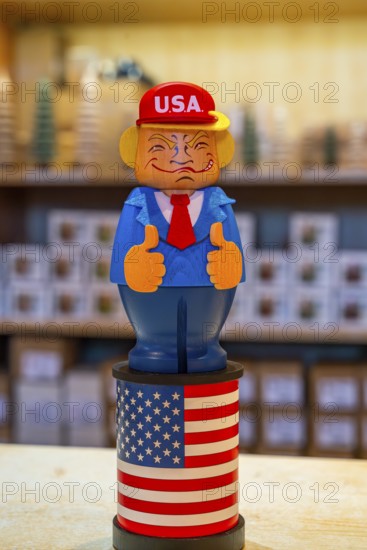 Carved wooden figure of US President Donald Trump, health resort and toy village Seiffen, Ore Mountains, Saxony, Germany