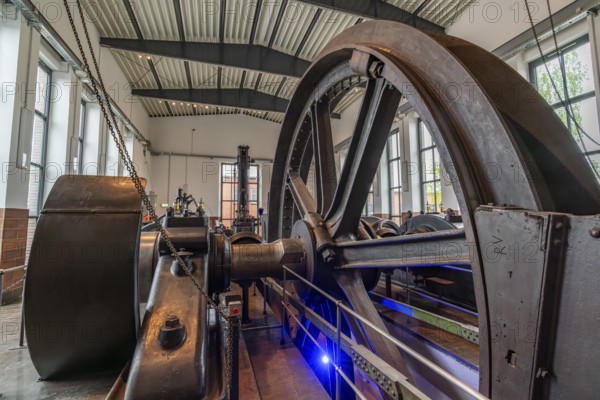 Large steel wheel of a steam engine in the coal world, Steinkohlebergbau Sachsen Museum, Oelsnitz im Erzgebirge, Saxony, Germany