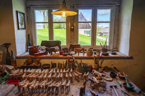 Wooden toys and tools in the historic workshop of a toy maker, Seiffen open-air museum, Ore Mountains, Saxony, Germany