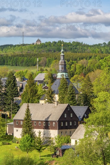 Residential buildings and landmarks of the historic mountain church, in the back forest on Schwartenberg, health resort and toy village Seiffen, Ore Mountains, Saxony, Germany