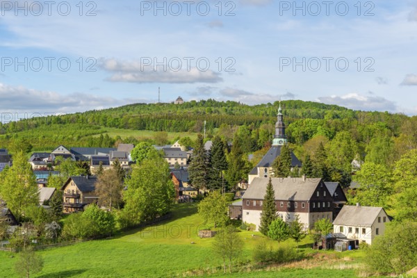 Residential buildings and landmarks of the historic mountain church, in the back forest on Schwartenberg, health resort and toy village Seiffen, Ore Mountains, Saxony, Germany