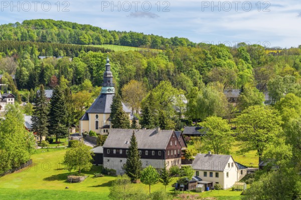 Residential buildings and landmarks of the historic mountain church, in the back forest, health resort and toy village Seiffen, Ore Mountains, Saxony, Germany