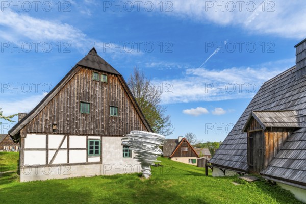 Sculpture, art installation Twister by artist and sculptor Alice Aycock, Purple Path art and sculpture trail of the European Cultural Region around the cultural capital Chemnitz, next to historic wooden houses in the Seiffen open-air museum, Ore Mountains, Saxony, Germany