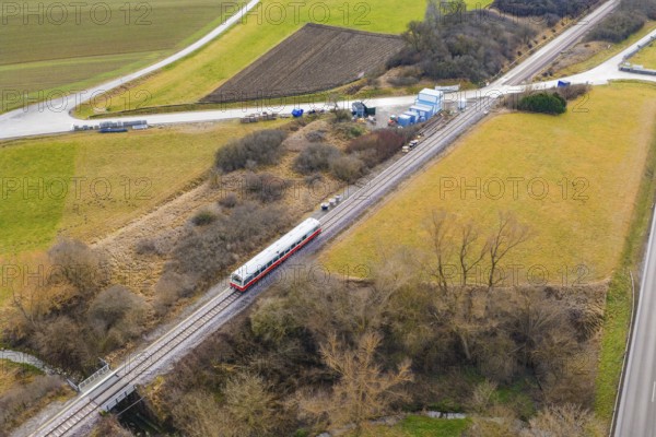 A train on rails crosses a rural landscape with fields and hills, historic event, first test run with a passenger train on the Hermann tracks, Hesse Railway since 1988, Calw district, Germany